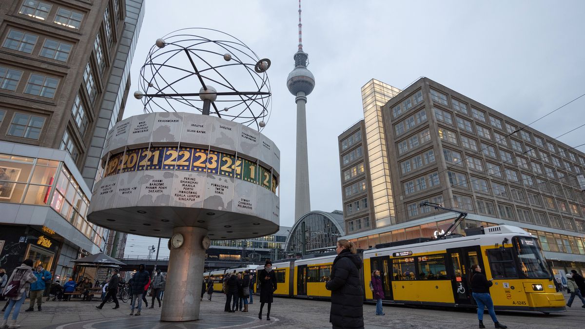 A passenger tram travels between the Urania World Clock, left, and the Berlin TV Tower on Alexanderplatz in Berlin, Germany, on Friday, Dec. 8, 2023. Chancellor Olaf Scholz and top officials in his governing coalition will reconvene on Monday afternoon to try to seal an agreement on a revised 2024 budget, according to people familiar with the planning. Photographer: Andrey Rudakov/Bloomberg via Getty Images