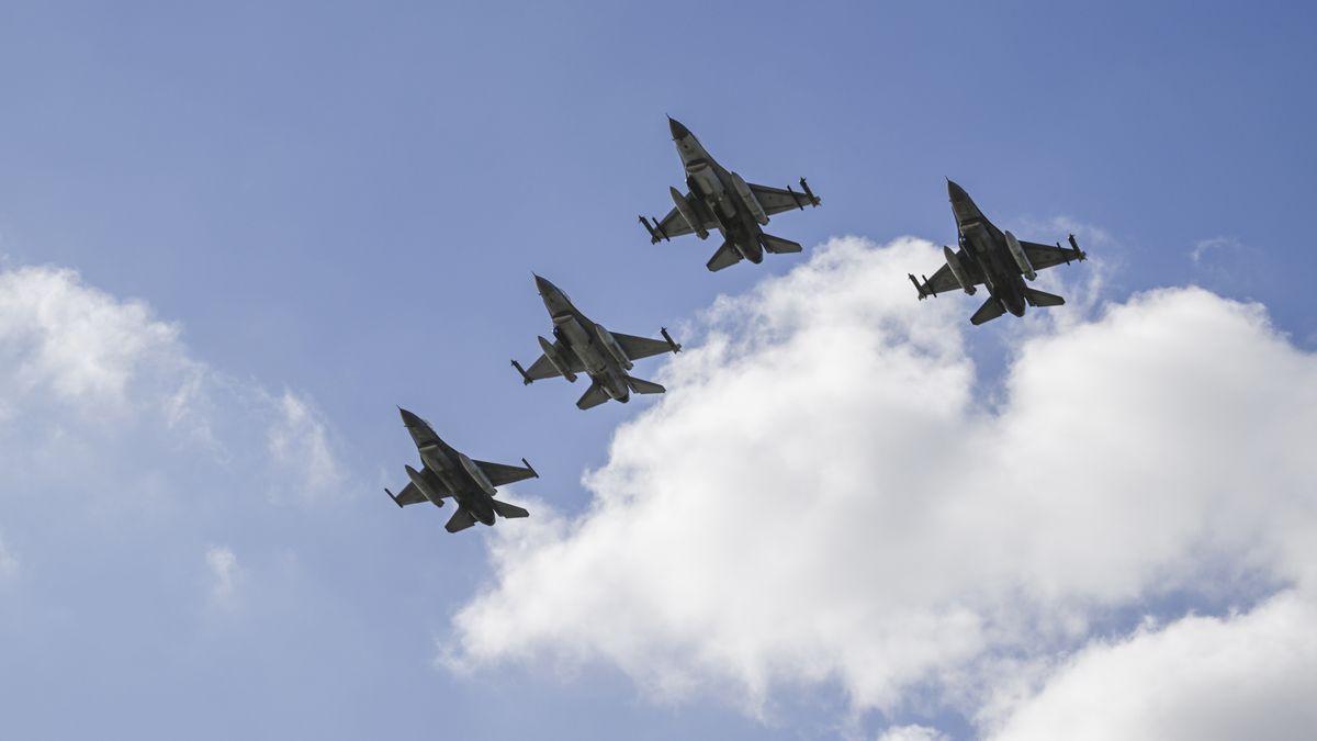 LISBON, PORTUGAL - APRIL 25: Portuguese Air Force F-16 M Fighting Falcons fly over Praça do Comercio during the military parade that opens the official ceremonies in celebration of the 50th anniversary of 1974 Carnation Revolution (Revolução dos Cravos) on April 25, 2024 in Lisbon, Portugal. Today marks the 50th anniversary of the Carnation Revolution (Revolução dos Cravos) led by the military and supported by the Portuguese people to overthrow the dictatorial regime of Estado Novo that became known as the Carnation Revolution. On April 25th 1974, democracy was restored, putting an end of 48 years of the National Dictatorship (1926-1933) and the Estado Novo of Salazar and Marcello Caetano (1933-1974) that were together the longest authoritarian regime in Western Europe during the 20th century. Ever since this 'Freedom Day' has been marked as a national holiday in Portugal. (Photo by Horacio Villalobos#Corbis/Getty Images)