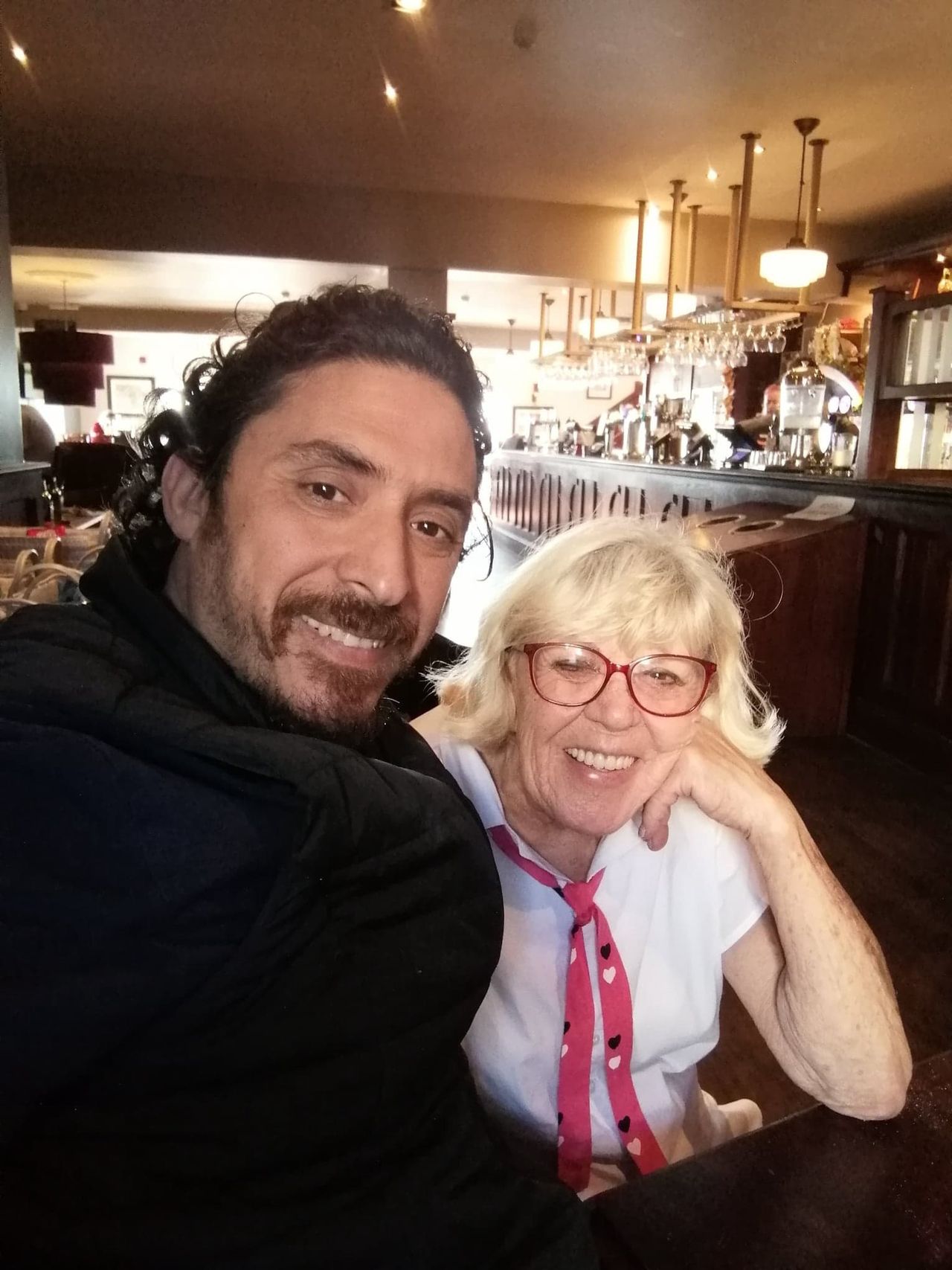 Iris Jones and Mohamed at a shared dinner