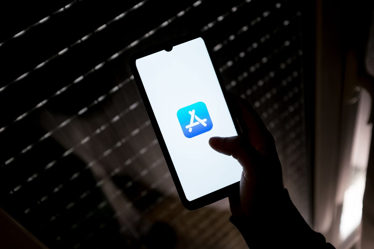 In this photo illustration an App Store logo seen displayed on a smartphone screen in Athens, Greece on March 16, 2022. (Photo by Nikolas Kokovlis/NurPhoto via Getty Images)