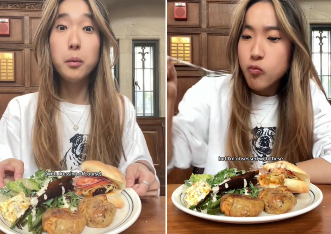 The TikToker at the university cafeteria filled her plate with food.