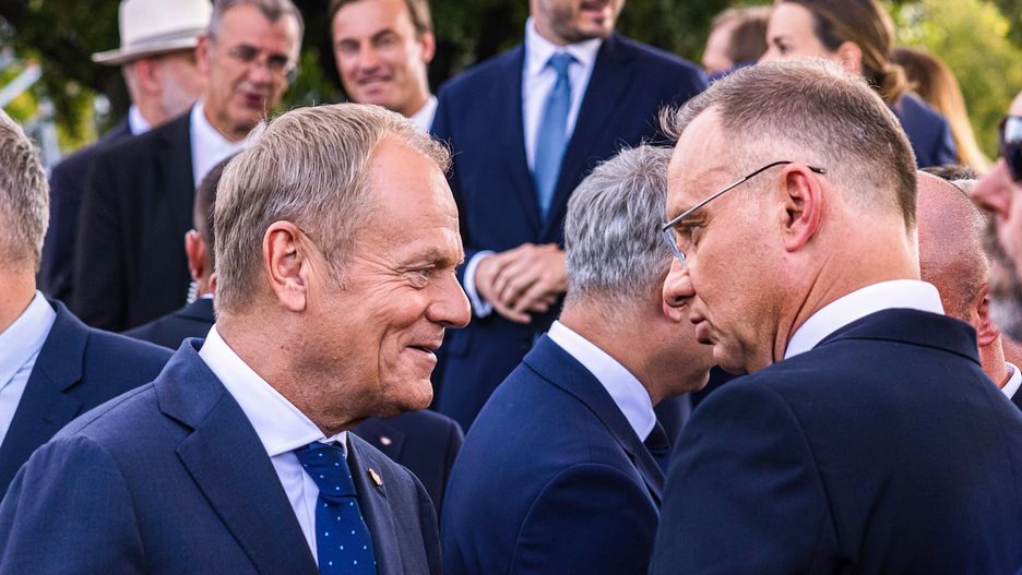 WARSAW, MAZOVIA, POLAND - 2024/08/15: (L-R) Polish Prime Minister Donald Tusk and President Andrzej Duda talk after the military parade. Poland celebrates its Armed Forces Day, and its 25th year as a member of NATO, with a military parade. Poland's armed forces, along with allied troops stationed in the country, participated in a parade in front of the public, the media, and assembled dignitaries. Before the parade, Poland's Deputy Prime Minister and Minister of National Defence, Wadysaw Kosiniak-Kamysz, Poland's Prime Minister, Donald Tusk, and Poland's President, Andrzej Duda addressed the public and the assembled media. The parade featured soldiers, mechanized divisions, tanks, various armoured vehicles, and a fly-over by members of Poland's Air Force. (Photo by Neil Milton/SOPA Images/LightRocket via Getty Images)
