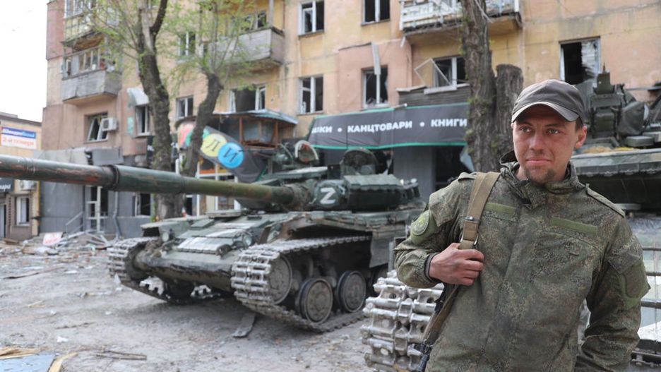 Russian attacks on UkraineMARIUPOL, UKRAINE - MAY 04: A DPR army fighter is seen in front of the tank as Russian attacks continue in Mariupol, Ukraine on May 04, 2022. Residents of Mariupol at this time are trying to survive on their own and in evacuation camps. (Photo by Leon Klein/Anadolu Agency via Getty Images)Anadolu Agencyrussian attacks, russian attacks on ukraine