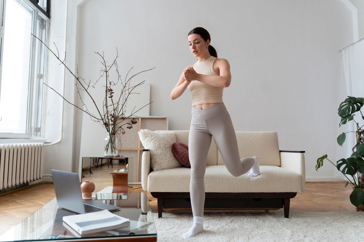 The woman exercises at home.