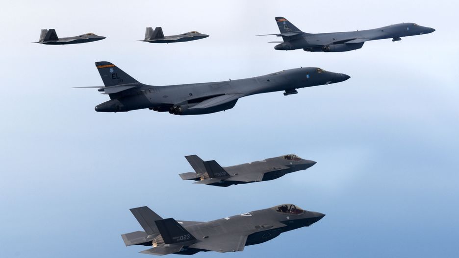 UNDISCLOSED LOCATION, SOUTH KOREA - FEBRUARY 01: In this handout image released by the South Korean Defense Ministry, U.S. Air Force B-1B bombers (C), F-22 fighter jets and South Korean Air Force F-35 fighter jets (bottom) fly over South Korea Peninsula during a joint air drill on February 01, 2023 at an undisclosed location in South Korea. South Korea and the United States staged combined air drills, involving B-1B strategic bombers and F-22 and F-35B stealth fighters from the U.S. Air Force, in a show of Washington's "will and capabilities" against North Korean threats, Seoul's defense ministry said. North Korea said it will take the "toughest reaction" to any U.S. military action in response to the U.S. defense chief's latest pledge to deploy more strategic assets to the Korean Peninsula to ensure its security commitment. (Photo by South Korean Defense Ministry via Getty Images)