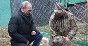 Putin z lampartem na kolanach