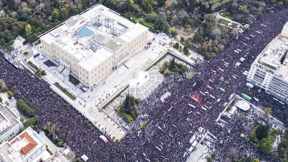 An aerial panoramic view from a drone shows hundreds of thousands of people demonstrating in Athens, Greece, on February 28, 2025, in front of the Hellenic Parliament, Syntagma Square, and all the surrounding roads, occupying kilometers, to mark the second anniversary of a train collision disaster at Tempi, known as the Tempi train crash, which killed 57 people in 2023. Thousands of protesters gather in Athens to demand justice two years after Greece's deadliest train crash. The tragedy, which occurs on February 28, 2023, near Tempi in northern Greece, kills 57 people, including university students and train crew members. In response to the crash's aftermath, workers stage a nationwide strike, halting flights, sea, and land transport, while shops close and theatres cancel performances. Demonstrators express their anger at the perceived lack of accountability for the devastating incident, accusing authorities of a cover-up and demanding the resignation of the current government. The protest is one of the largest ever recorded in the country.  (Photo by STR/NurPhoto via Getty Images)