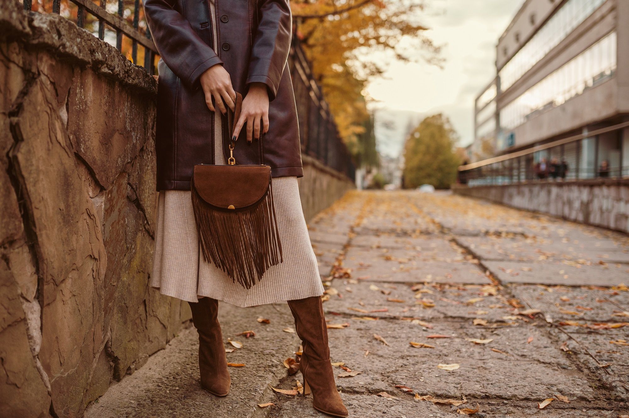 fashion, bag, brown, fringe, handbag, woman, suede, luxury, trend, autumn, fall, elegant, street, style, details, wear, accessories, look, outfit, outdoor, posing, purse, boots, lady, heels, leather, trench, coat, dress, clothes, midi, high, shoes, city, urban, elements, holding, top handle, small, color, natural, model, girl, female, chic, pointed toe, trendsetter, blogger, fashionista, copy space