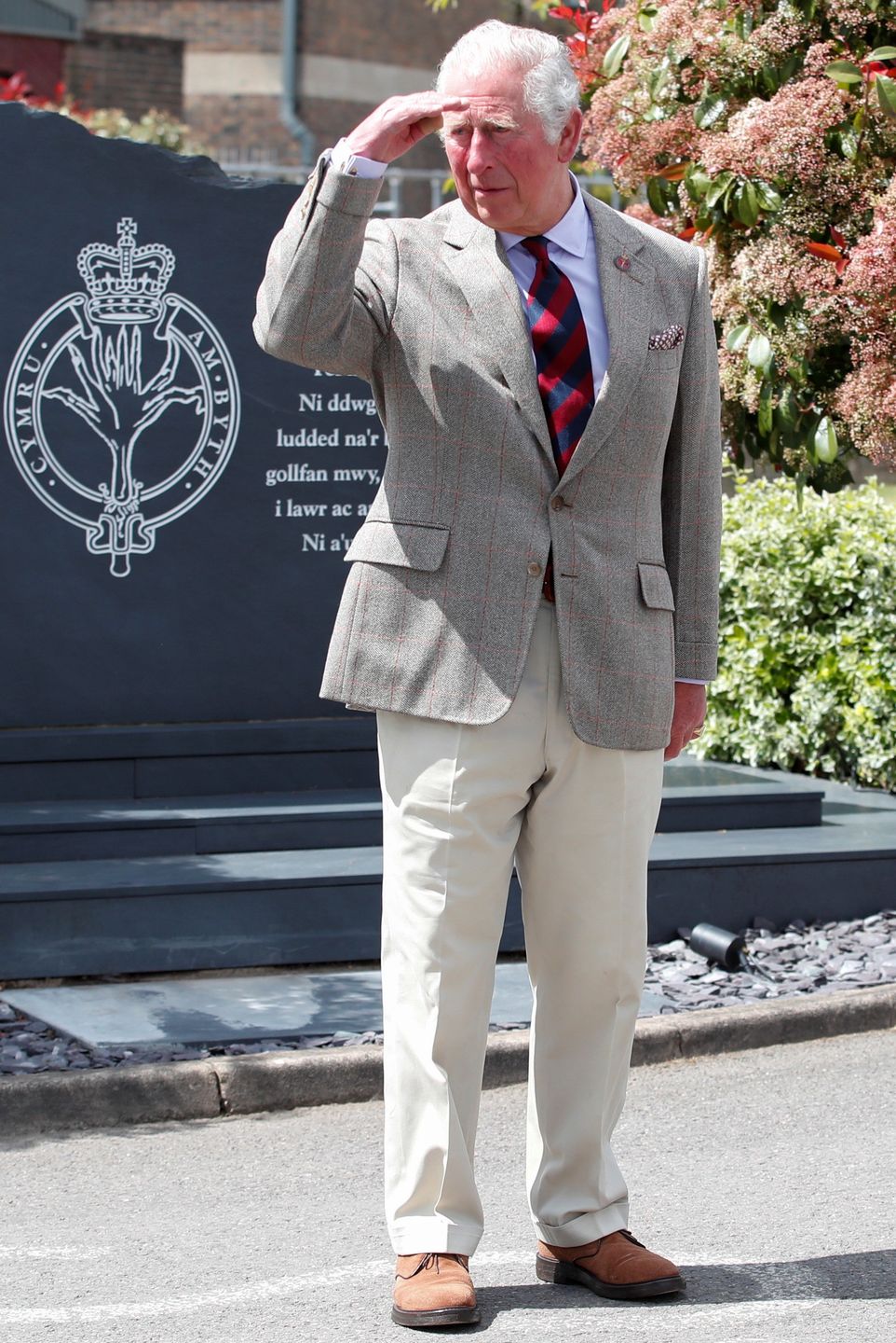 WINDSOR, ENGLAND - MAY 05: Prince Charles, Prince of Wales gestures next to a memorial during a visit to the Welsh Guards at Combermere Barracks on May 5, 2021 in Windsor, England. (Photo by Peter Cziborra - WPA Pool/Getty Images)