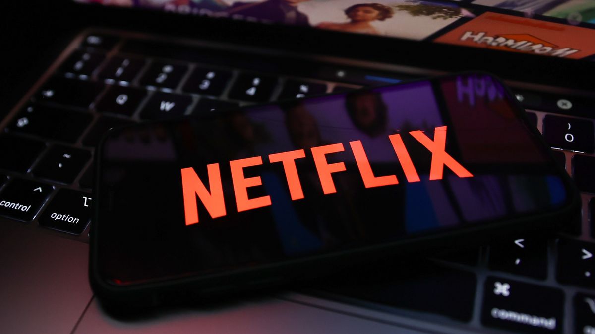 Netflix logo displayed on a phone screen and Netflix website displayed on a laptop screen are seen in this illustration photo taken in Krakow, Poland on July 14, 2022. (Photo by Jakub Porzycki/NurPhoto via Getty Images)