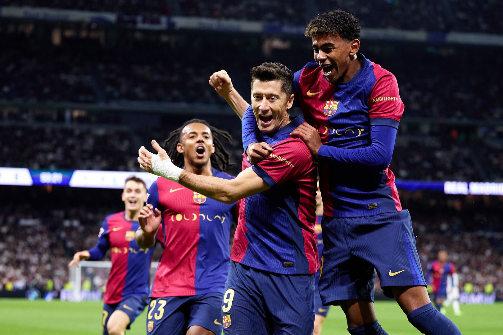 Real Madrid CF v FC Barcelona - La Liga EA Sports
MADRID, SPAIN - OCTOBER 26: Robert Lewandowski of FC Barcelona celebrates after scoring their side's first goal with his teammate Lamine Yamal of FC Barcelona during the LaLiga match between Real Madrid CF and FC Barcelona at Estadio Santiago Bernabeu on October 26, 2024 in Madrid, Spain. (Photo by Alvaro Medranda/Quality Sport Images/Getty Images)
Quality Sport Images