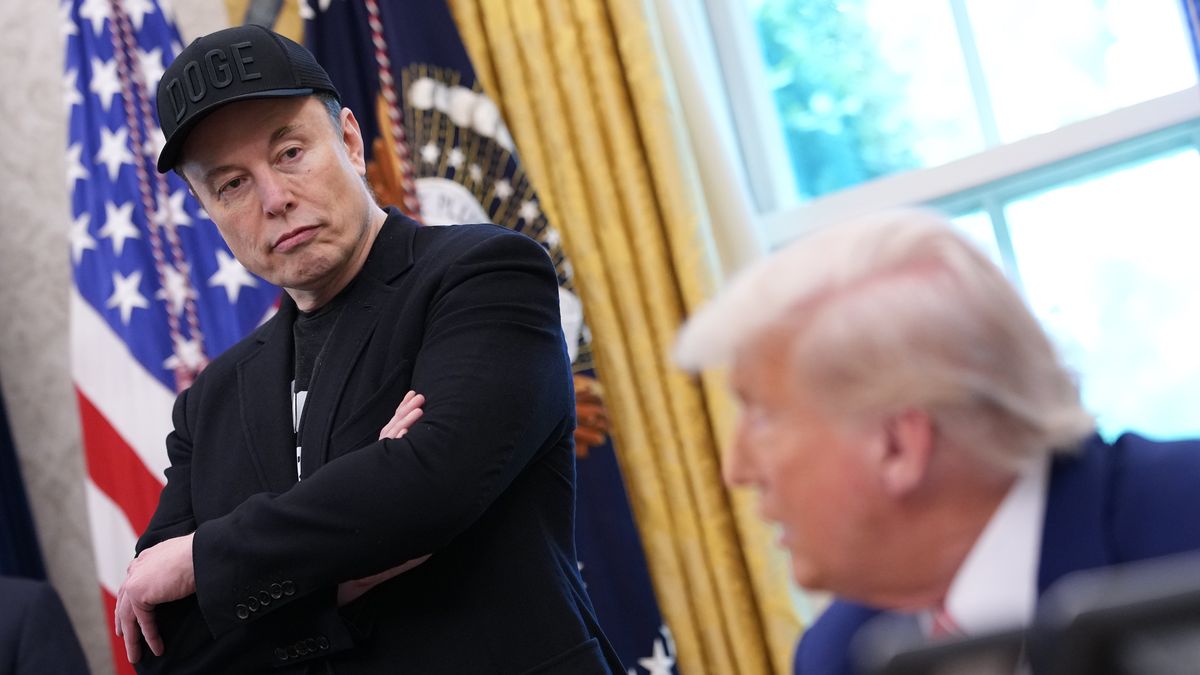 WASHINGTON, DC - MAY 30: Tesla CEO Elon Musk listens as U.S. President Donald Trump speaks to reporters in the Oval Office of the White House on May 30, 2025 in Washington, DC. Musk, who served as an adviser to Trump and led the Department of Government Efficiency, announced he would leave his role the Trump administration to refocus on his businesses. (Photo by Kevin Dietsch/Getty Images)