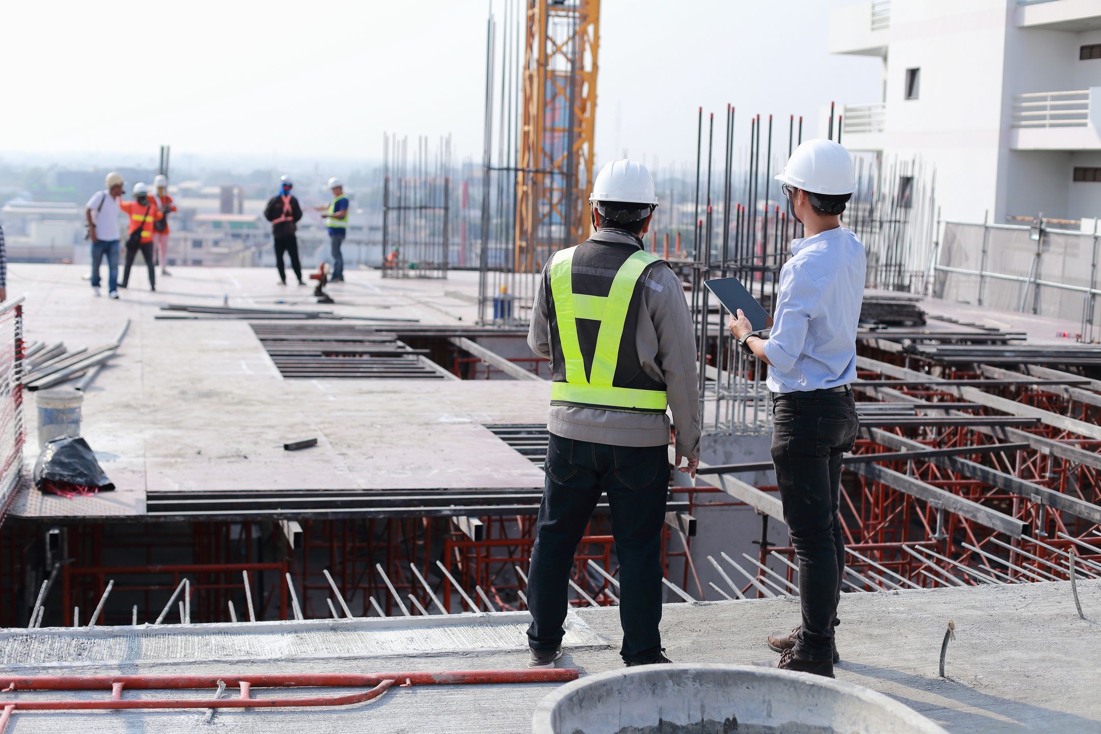 Two engineers work on the construction site. They are checking the progress of the work.
architecture, business, manager, construction, project, helmet, design, two, industry, people, architect, structure, man, engineering, site, work, development, plan, building, blueprint, worker, professional, industrial, workplace, on site, visit, management, inspector, blue, outdoor, asian, protect, job, hard, view, drawing, meeting, engineers, plant, safety, contractor, consult, structural, civil, builder, concept, working, team, engineer