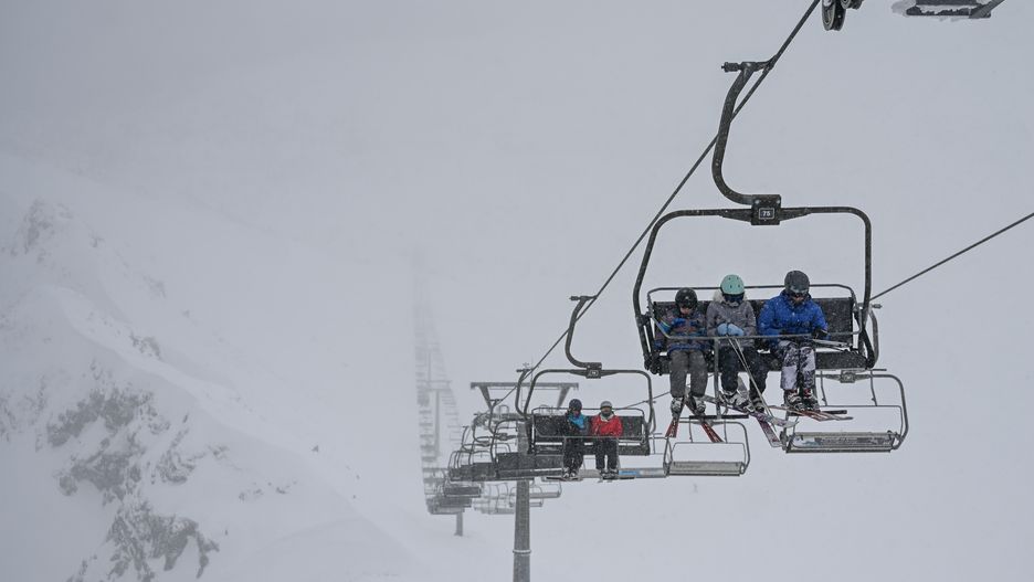 ZAKOPANE, POLAND - JANUARY 16: People and skiers are seen at the Kasprowy Wierch peak during a snowstorm in Zakopane, Poland on January 16, 2024. Kasprowy Wierch is one of the most famous peaks of the Tatra mountains in Southern Poland, which is also a winter attraction as ski lifts and trails are available for visitors. More than 90 cm of snow has fallen in Tatras and more snowfall is predicted during the upcoming weeks. (Photo by Omar Marques/Anadolu via Getty Images)