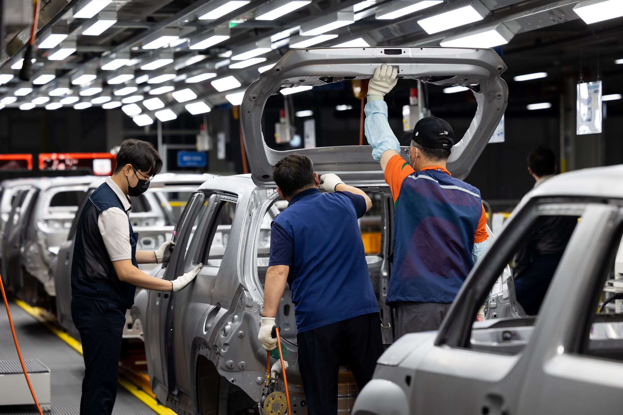 Employees assemble Hyundai Motor Co. Casper mini sport utility vehicles (SUV) on the production line at the Gwangju Global Motors (GGM) factory in Gwangju, South Korea, on Wednesday, Oct. 13, 2021. Gwangju Global Motors started production of Casper from September and aims to produce about 70,000 vehicles annually, according to the company. Photographer: SeongJoon Cho/Bloomberg via Getty Images