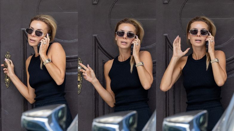 Izabela Janachowska zasłania się parasolem w drodze do samochodu