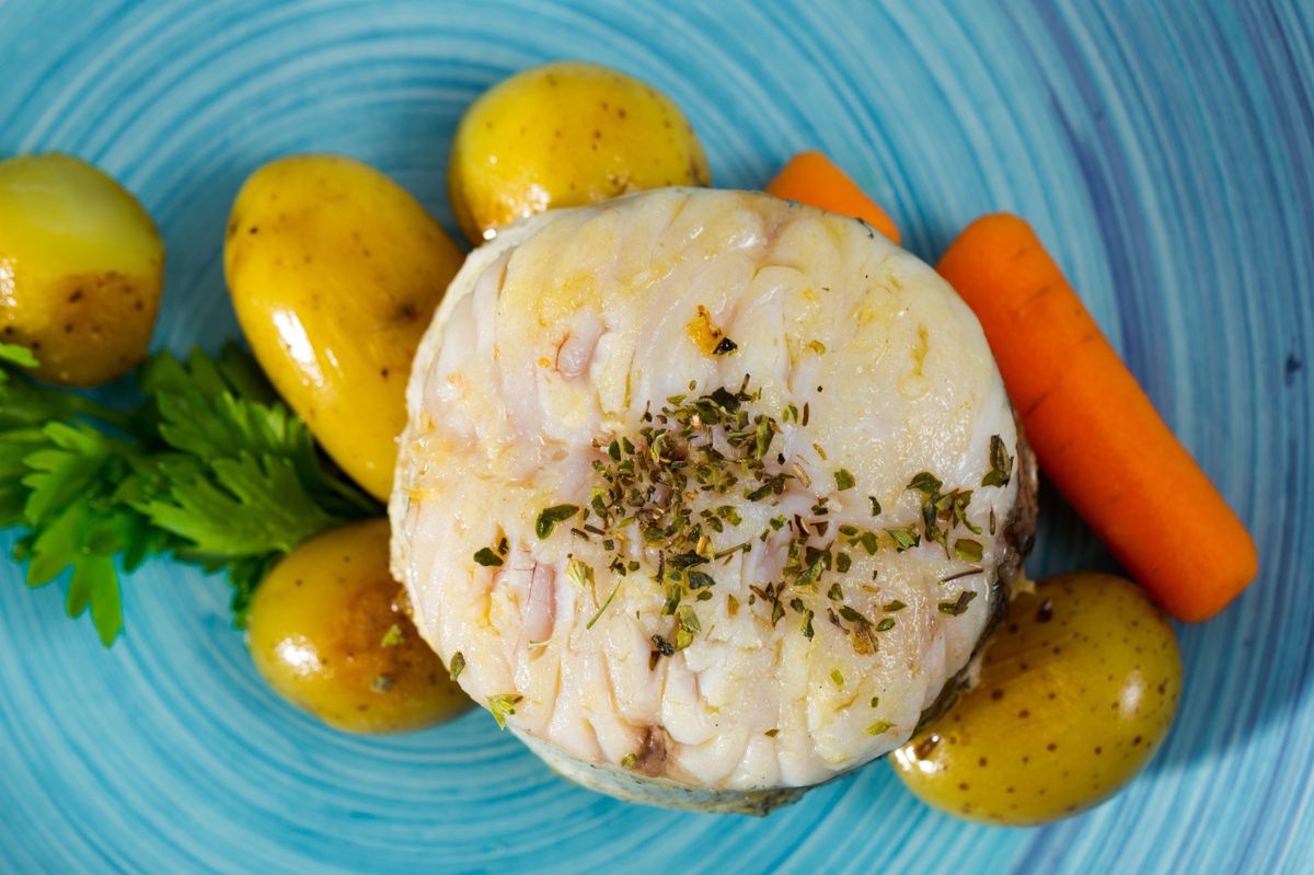 Hake served with cooked vegetables