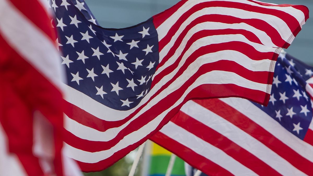 KANSAS CITY, KS - JULY 18: Fans wave the US Flag during the group B final match between the United States and Canada on Sunday July 18, 2021 at Childrens Mercy Park in Kansas City, KS.  (Photo by Nick Tre. Smith/Icon Sportswire via Getty Images)