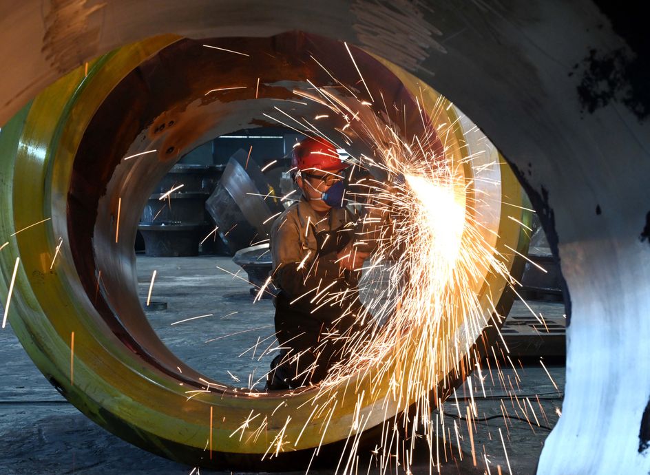 JINHUA, CHINA - FEBRUARY 26: A worker polishes steel at the polishing workshop of Zhejiang Wujing Machine Manufacture Co., Ltd. on February 26, 2024 in Jinhua, Zhejiang Province of China. (Photo by VCG/VCG via Getty Images)
