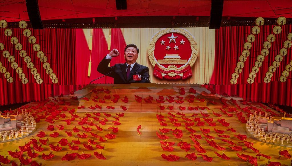 China Celebrates 100th Anniversary Of The Communist Party At Mass GalaBEIJING, CHINA - JUNE 28: Chinese President and Chairman of the Communist Party Xi Jinping appears on a large screen as performers dance during a mass gala marking the 100th anniversary of the Communist Party on June 28, 2021 at the Olympic Bird's Nest stadium in Beijing, China. China will officially mark the100th anniversary of the founding of the Communist Party on July 1st. (Photo by Kevin Frayer/Getty Images)Kevin Frayer