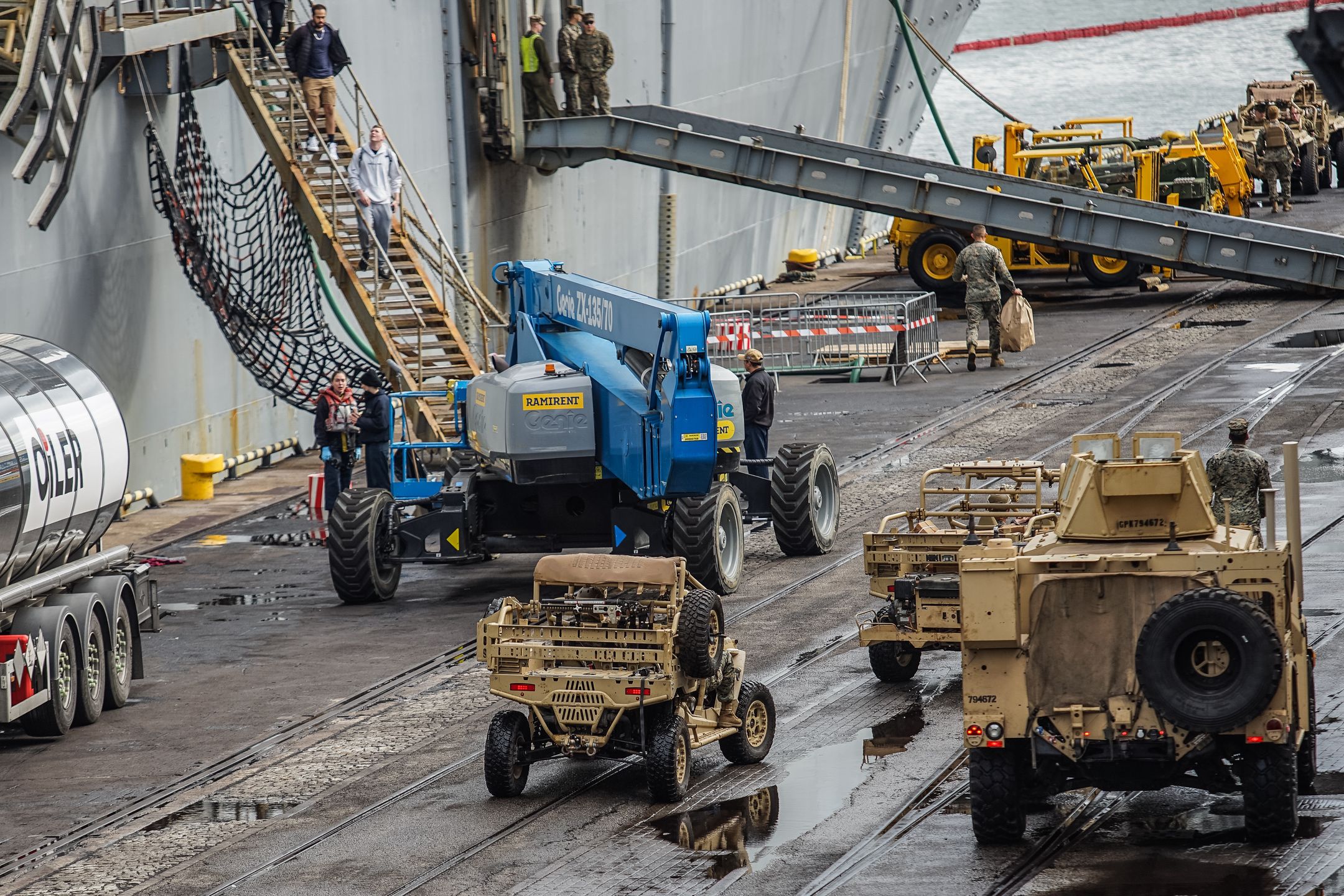 US Marines corp soldiers in front of Wasp-class amphibious assault ship of the United States Navy USS Kearsarge are seen in Gdynia, Poland on 17 September 2022 The ship visits Gdynia to replenish supplies. The increased presence of American warships in the Baltic Sea is related to Russia's war against Ukraine (Photo by Michal Fludra/NurPhoto via Getty Images)