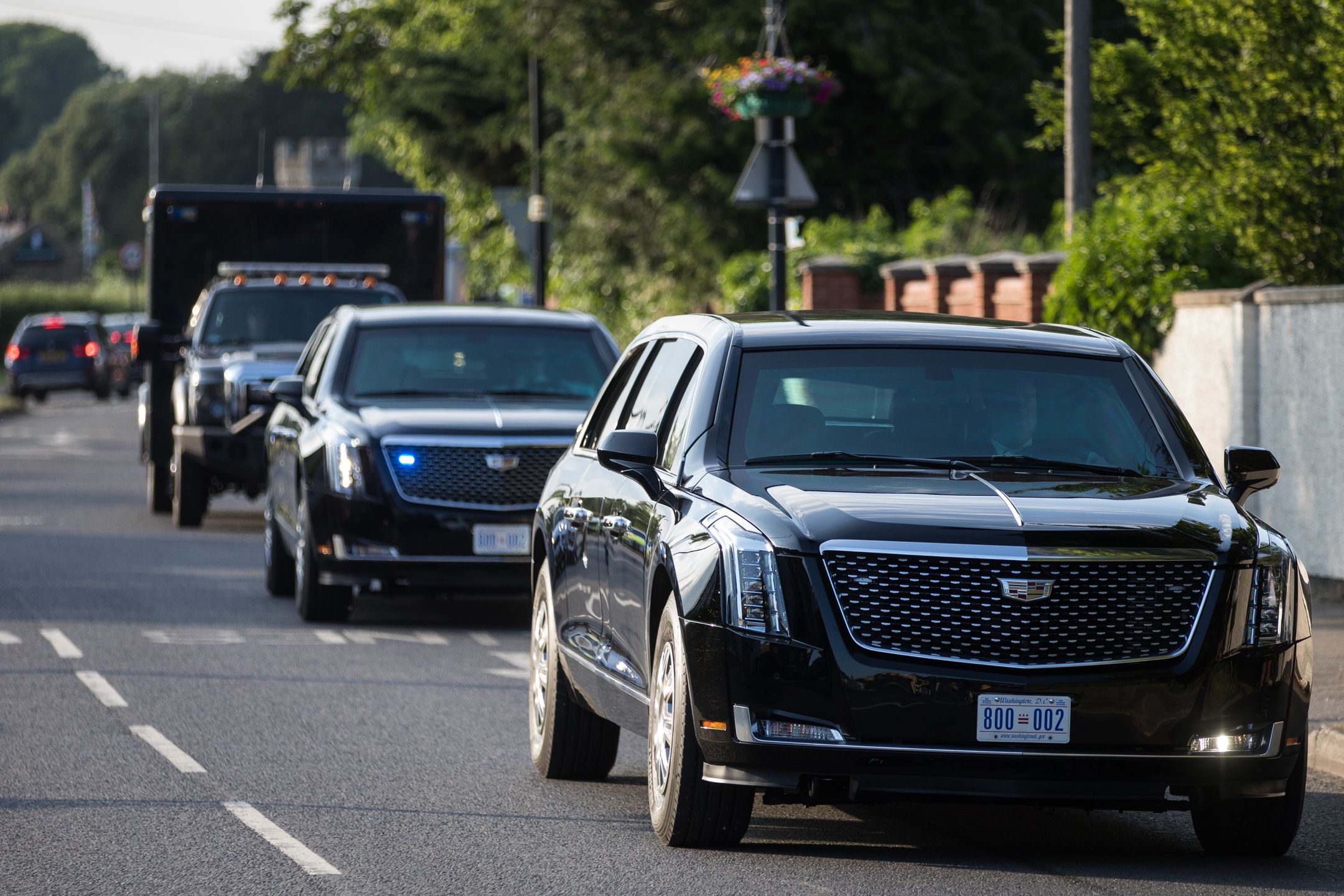 A cavalcade of vehicles led by the two Cadillacs known as the Beast leaves Windsor Castle following President Biden's visit on 13th June 2021 in Windsor, United Kingdom. President Biden and First Lady Jill Biden were welcomed by the Queen at Windsor Castle following the G7 summit with a Guard of Honour followed by afternoon tea. (photo by Mark Kerrison/In Pictures via Getty Images)