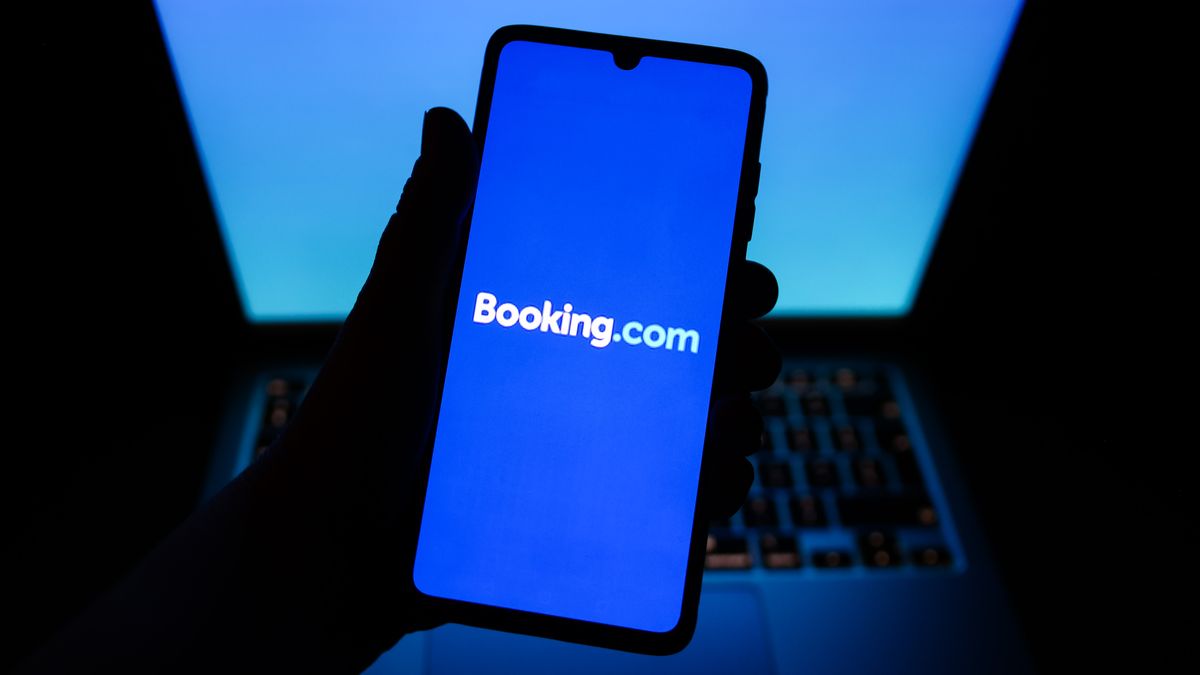 Booking.com name is displayed on a mobile phone screen for illustration photo. Krakow, Poland on February 9, 2023.  (Photo by Beata Zawrzel/NurPhoto via Getty Images)