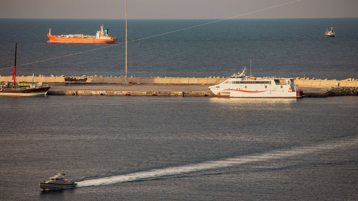 MUSCAT, OMAN - MARCH 30: A police speed boat patrols the port as oil tankers and high speed crafts sit anchored at Muscat Anchorage near the Strait of Hormuz on March 30, 2026 in Muscat, Oman. Several Chinese-owned vessels were reportedly able to transit the Strait of Hormuz today, the day after U.S. President Donald Trump said Iran would allow 20 ships to cross through the vital waterway. Maritime traffic through the Strait of Hormuz, which conveys about a fifth of the world's oil and gas, has mostly come to a halt after the joint U.S.-Israeli war with Iran that began on February 28. (Photo by Elke Scholiers/Getty Images)
