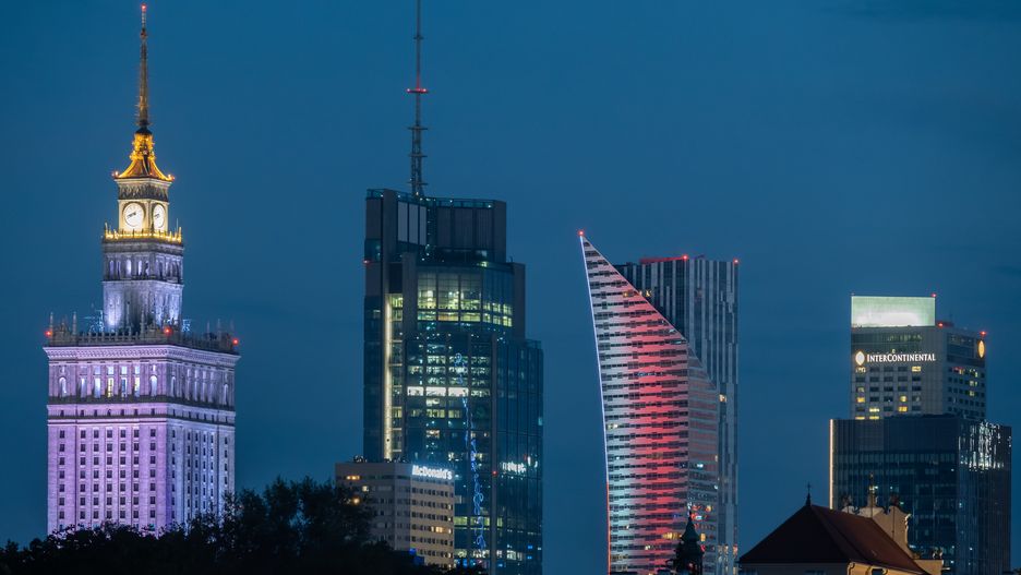 WARSAW, POLAND - 2024/08/17: General overview of the illuminated modern cityscape during night time with skyscrapers of the capital of Poland Warsaw. Seen from left: iconic Palace of Culture and Science (in Polish Palac Kultury i Nauki), highest building of the European Union Varso tower, Warsaw Spire and InterContinental Warsaw. Warsaw is the largest city in Poland and its economic and business centre is a home to 13 skyscrapers buildings, which are at least 150 meters tall. (Photo by Tomas Tkacik/SOPA Images/LightRocket via Getty Images)
