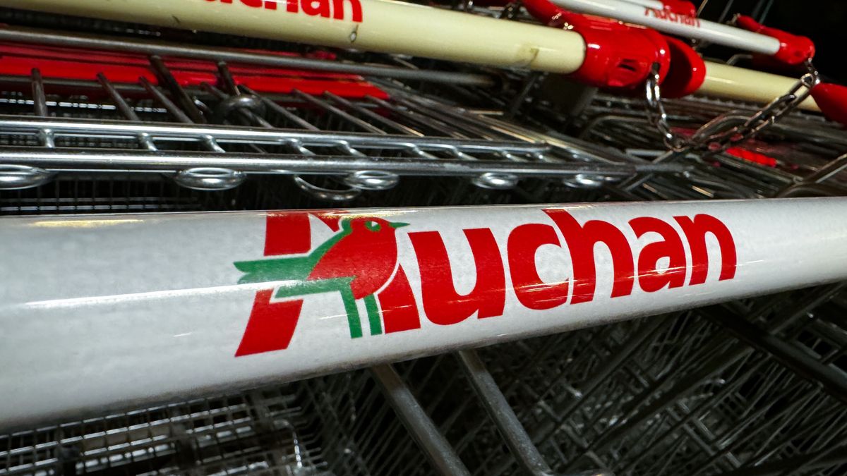 Auchan logos are seen on shopping trolleys near the supermarket in Krakow, Poland on August 1, 2024. (Photo by Jakub Porzycki/NurPhoto via Getty Images)