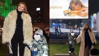 Joanna Opozda bawi się z synem na świątecznym jarmarku i pozuje na tle... własnego billboardu. Słodko? (FOTO)