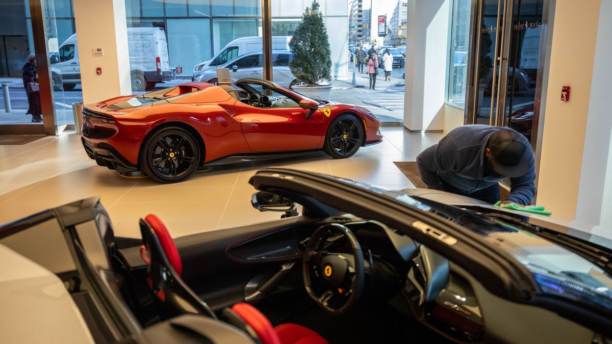 A Ferrari SF90 Spider and 296 GTS at a dealership on Park Ave. in New York, US, on Tuesday, Feb. 4, 2025. Ferrari NV saw resilient sales of its sports cars in the fourth quarter as strong US demand helped the Italian manufacturer brush off a downturn for luxury automakers. Photographer: Yuki Iwamura/Bloomberg via Getty Images