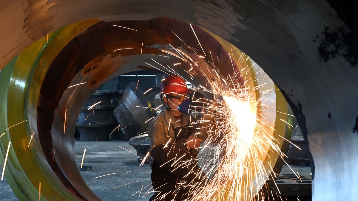JINHUA, CHINA - FEBRUARY 26: A worker polishes steel at the polishing workshop of Zhejiang Wujing Machine Manufacture Co., Ltd. on February 26, 2024 in Jinhua, Zhejiang Province of China. (Photo by VCG/VCG via Getty Images)