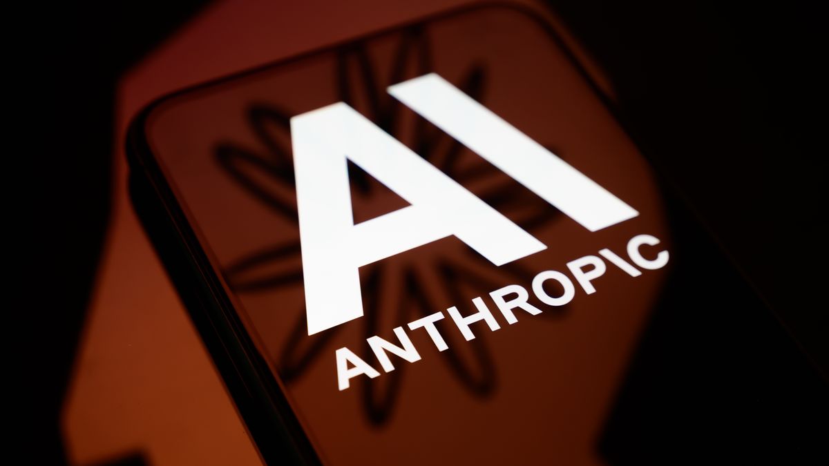 The Anthropic logo is displayed on a smartphone screen placed on a reflective surface onto which a company branding illustration is projected, in Creteil, France, on June 2, 2026. Anthropic confirms that it has confidentially filed for an IPO. (Photo by Samuel Boivin/NurPhoto via Getty Images)