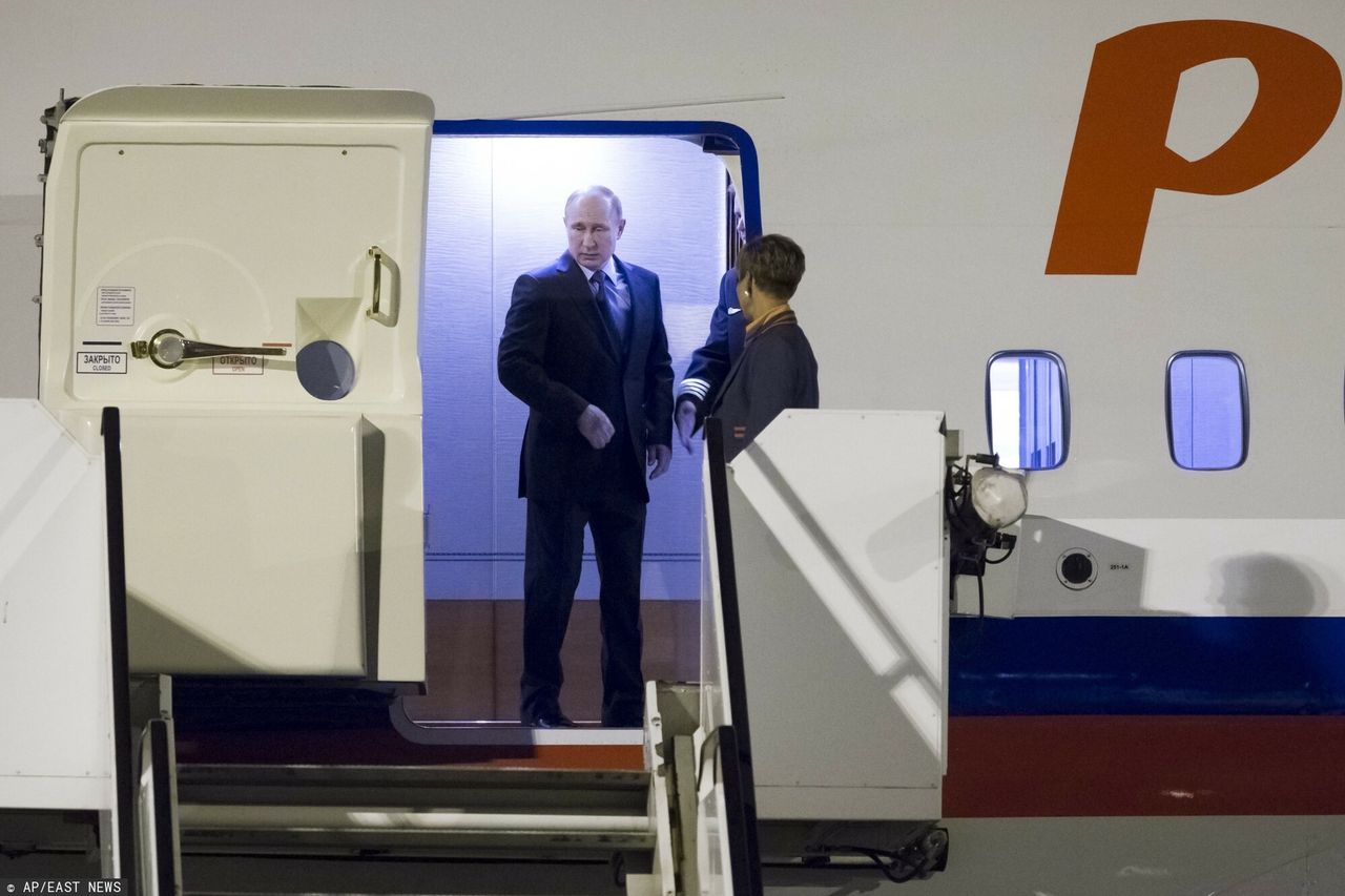 Vladimir Putin on an aeroplane
