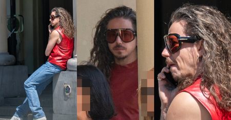 Uzbrojony w białe botki na obcasie Michał Szpak snuje się po mieście i gawędzi przez telefon. Fajny "look"? (ZDJĘCIA)