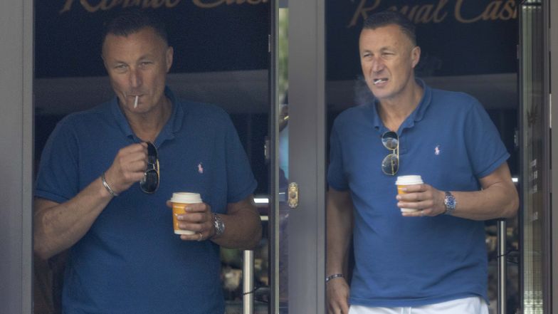 Tomasz Hajto delektuje się papierosem przed lombardem