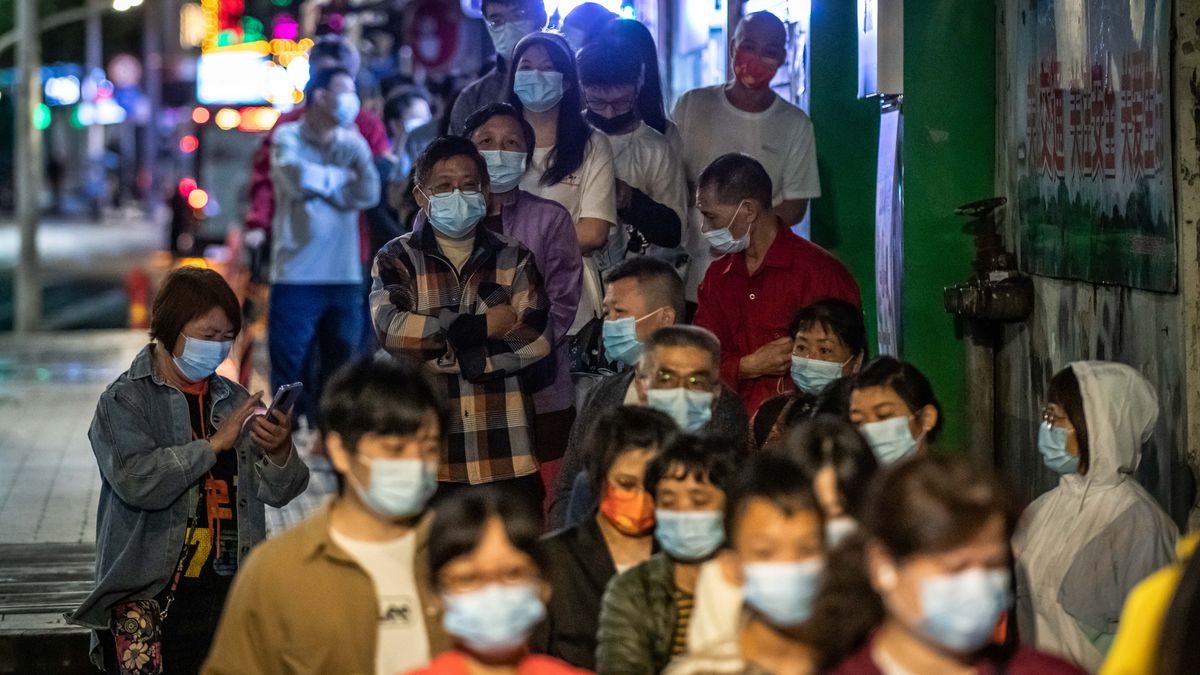 GUANGZHOU, CHINA - MAY 15: People queue up for COVID-19 nucleic acid tests on May 15, 2022 in Guangzhou, Guangdong Province of China. (Photo by VCG/VCG via Getty Images)
