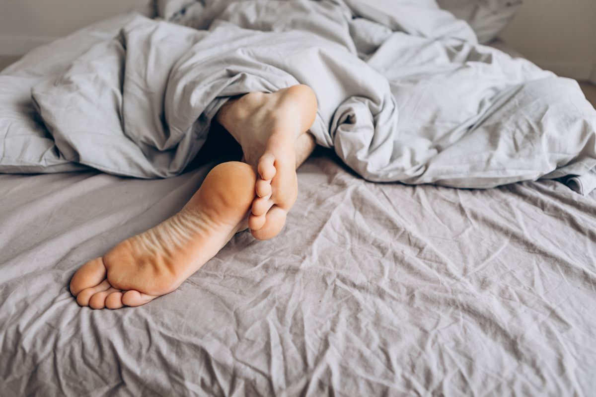 Why do we stick our feet out from under the duvet?