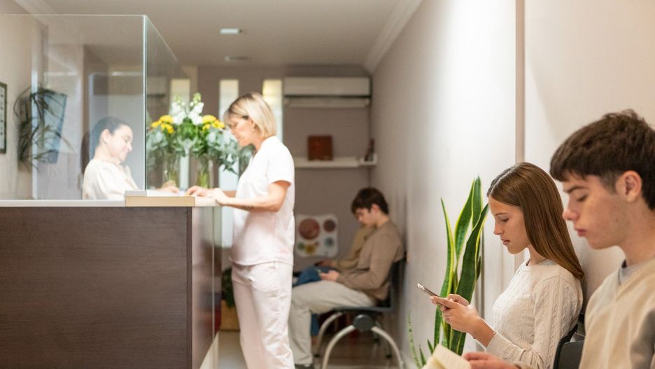 Patients in the waiting room of a medical clinic