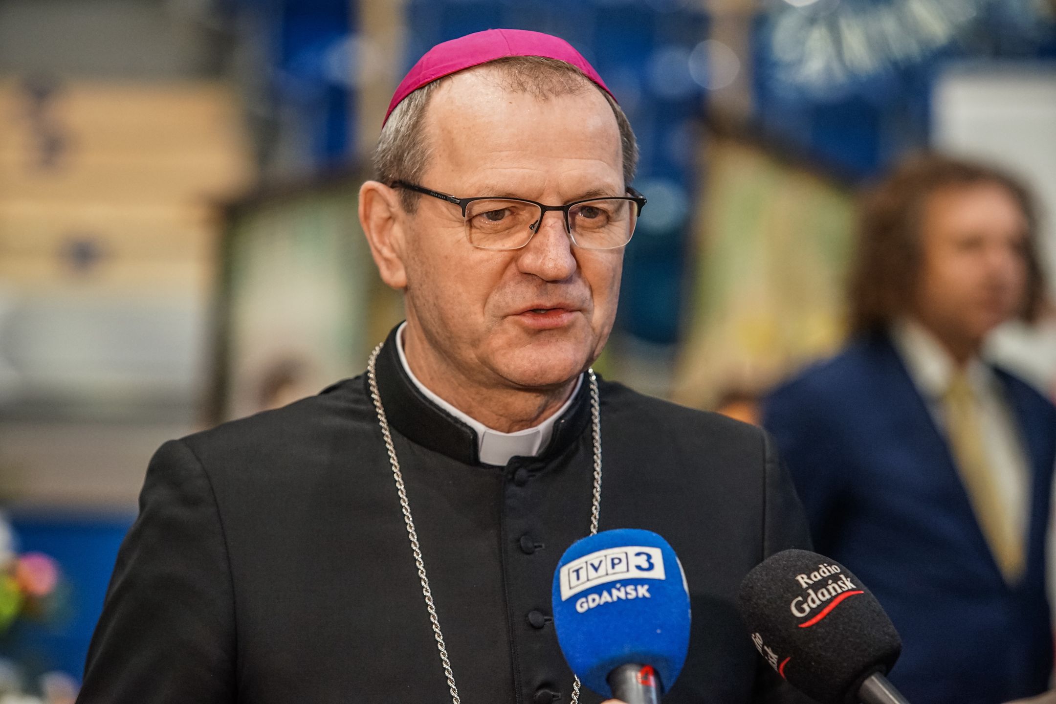 Archbishop Tadeusz Wojda talking to over 300 people who took part in the Christmas Eve meal is seen in Sopot, Poland on 24 December 2022  Traditional Polish Christmas Eve meal was organised by Caritas Poland Christian charity organisation. People shared a special wafer when exchanging Christmas greetings. Homeless and poor were regaled with traditional Polish bigos, pierogi,fish, bread and cakes. (Photo by Michal Fludra/NurPhoto via Getty Images)