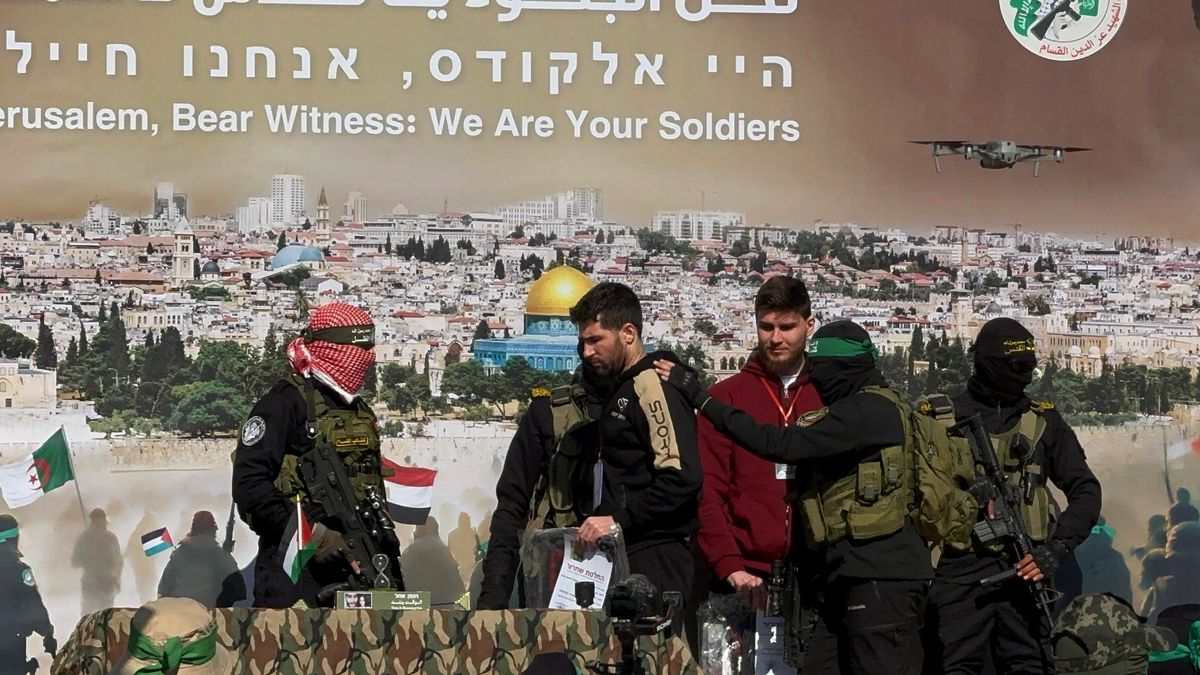 KHAN YUNIS, GAZA - FEBRUARY 15: Al-Qassam Brigades, the armed wing of Hamas, hand over Israeli hostages Alexander (Sasha) Turbanov, Sagui Dekel-Chen, and Yair Horn to Red Cross teams near the house of Yahya Sinwar, one of the killed leaders of Hamas in the southern Gaza Strip, within the 6th round of prisoner and hostage swap deal between Hamas and Israel in Khan Yunis, Gaza on February 15, 2025. (Photo by Abdallah F.s. Alattar/Anadolu via Getty Images)