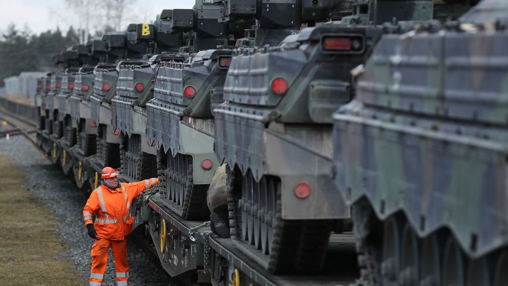 Bundeswehr Ships Heavy Weaponry To Lithuania
GRAFENWOEHR, GERMANY - FEBRUARY 21:  A railway worker checks Marder light tanks of the Bundeswehr, the German armed forces, after they had been loaded onto a train for transport to Lithuania on February 21, 2017 in Grafenwoehr, Germany. The Bundeswehr is participating in the enhanced Forward Presence operation of NATO, in which multinational contingents are strengthening the defensive capabilities of the three Baltic states and Poland in light of Russia's recent interventions in Crimea and eastern Ukraine. Germany is leading the contingent in Lithuania and is sending 450 troops, as well as light and heavy tanks and other combat equipment.  (Photo by Sean Gallup/Getty Images)
Sean Gallup