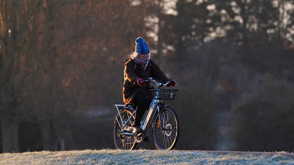 A cyclist beside the River Cam in Cambridge at sunrise. Picture date: Tuesday January 17, 2023. (Photo by Joe Giddens/PA Images via Getty Images)
