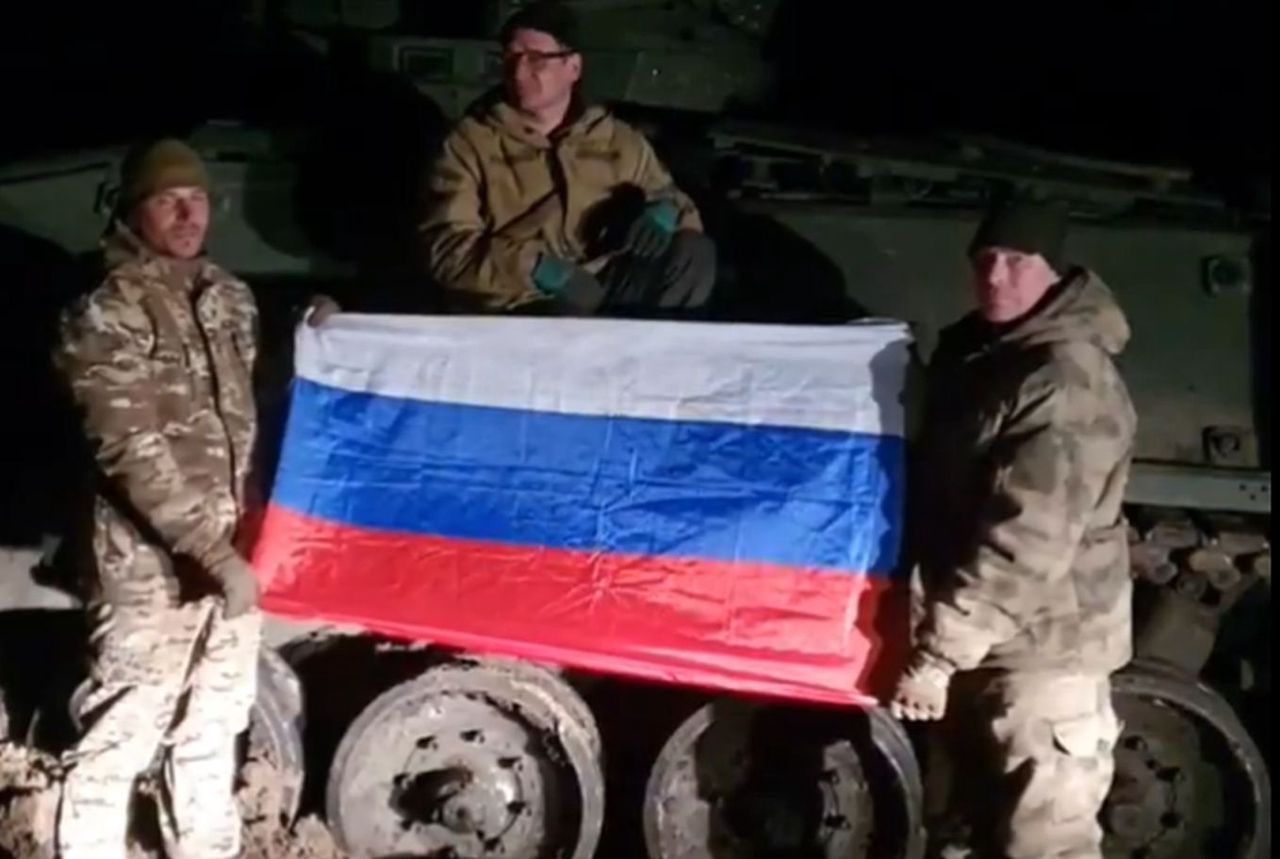 Russian soldiers with a German Marder infantry fighting vehicle