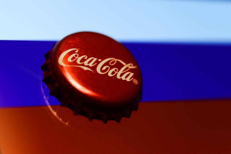 Coca-Cola cap and Russian flag displayed on a phone screen are seen in this illustration photo taken in Krakow, Poland on March 6, 2022.  (Photo illustration by Jakub Porzycki/NurPhoto via Getty Images)