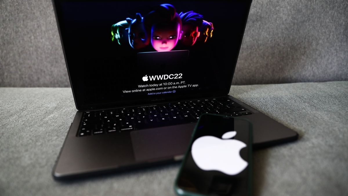 Apple website displayed on a laptop screen and Apple logo displayed on a phone screen are seen in this illustration photo taken in Krakow, Poland on June 6, 2022. This year's Apple Worldwide Developers Conference begins today. (Photo by Jakub Porzycki/NurPhoto via Getty Images)