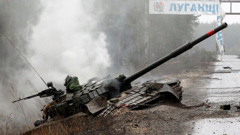 TemporarySmoke rises from a Russian tank destroyed by the Ukrainian forces on the side of a road in Lugansk region on February 26, 2022. - Russia on February 26 ordered its troops to advance in Ukraine "from all directions" as the Ukrainian capital Kyiv imposed a blanket curfew and officials reported 198 civilian deaths. (Photo by Anatolii Stepanov / AFP)ANATOLII STEPANOV