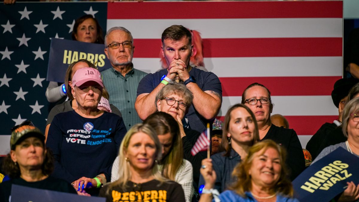 KALAMAZOO, MICHIGAN - OCTOBER 26: Attendees listen as Democratic presidential nominee, U.S. Vice President Kamala Harris speaks during a campaign rally at the Wings Event Center on October 26, 2024 in Kalamazoo, Michigan. Vice President Harris will be campaigning today with former U.S. First Lady Michelle Obama in the battleground swing state of Michigan. With 10 days remaining, Harris continues campaigning against Republican presidential nominee, former U.S. President Donald Trump ahead of the November 5 election.  (Photo by Brandon Bell/Getty Images)