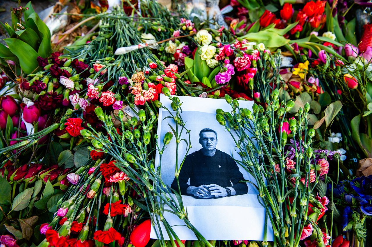 AMSTERDAM, NETHERLANDS - 2024/03/08: A black and white portrait of Alexei Navalny is seen placed in the middle of flowers. Three weeks after the death of Russian opposition leader, lawyer, anti-corruption activist, and political prisoner Alexei Navalny, the memorial that was placed at the center of the city of Amsterdam, full of flowers and messages in support of him. Alexei Navalny's death in prison was announced on 16 February by the prison authorities at the Siberian penal colony where he was being held. Alexei Navalny's widow Yulia has vowed to continue his work to fight for a "free Russia" in a video posted a few weeks ago. (Photo by Ana Fernandez/SOPA Images/LightRocket via Getty Images)